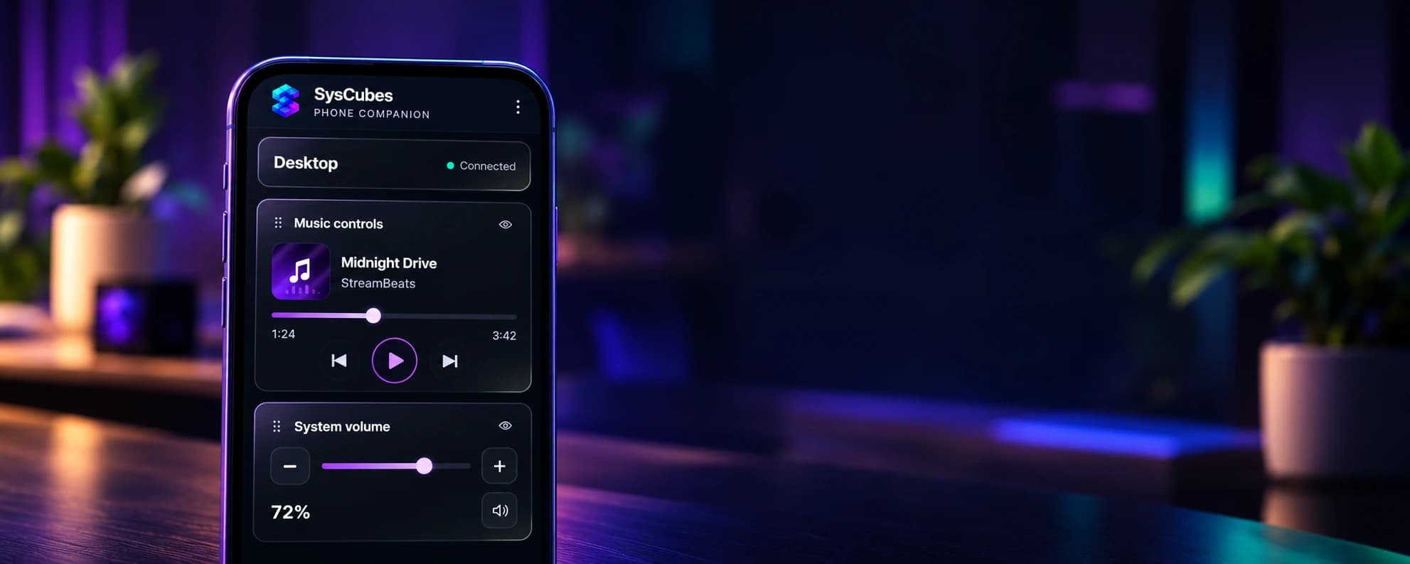 A phone displaying SysCubes media and volume controls on a softly lit desk.
